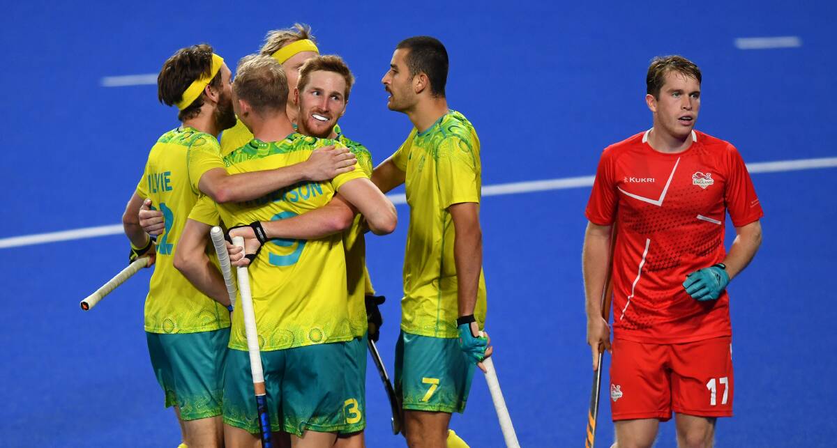 WINNER: The Kookaburras - including Wollongong's Flynn Ogilvie (left) - celebrate after scoring their third goal against England. Picture: Tom Dulat/Getty Images