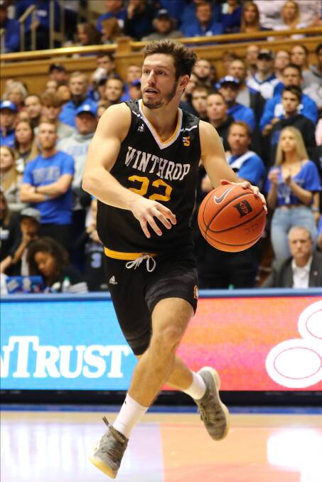 ON TRACK: Kyle Zunic looks to pass the ball to a Winthrop Eagles teammate at Durham's Cameron Indoor Stadium in November. Picture: Jaylynn Nash/Icon Sportswire via Getty Images