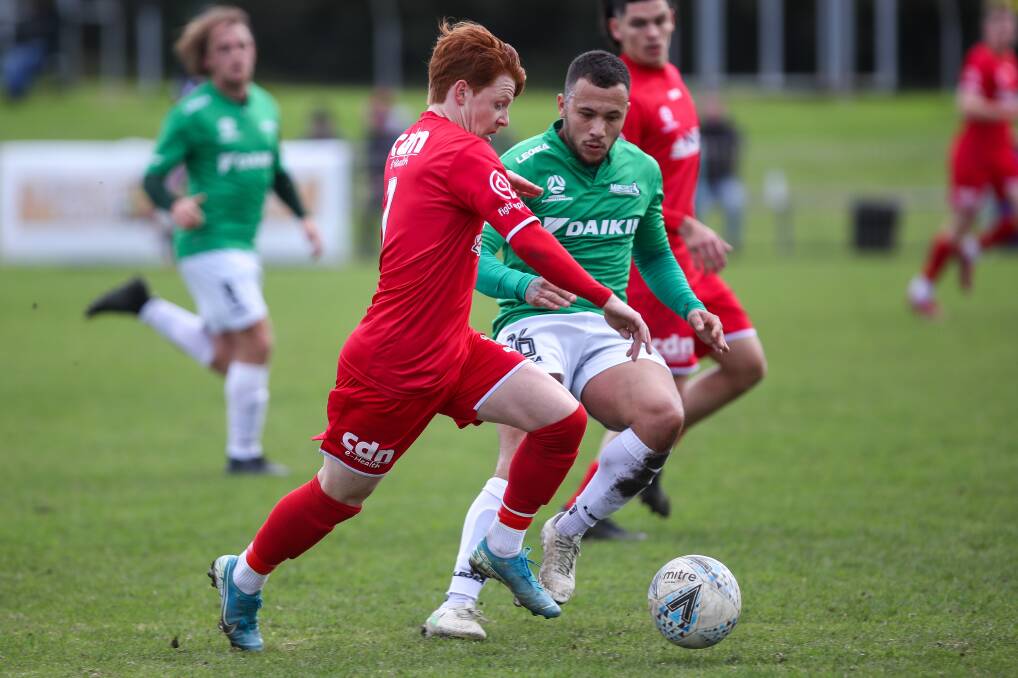 MOVING FORWARD: Wollongong Wolves player Marcus Beattie leads the chase to the ball against Marconi. Picture: Adam McLean