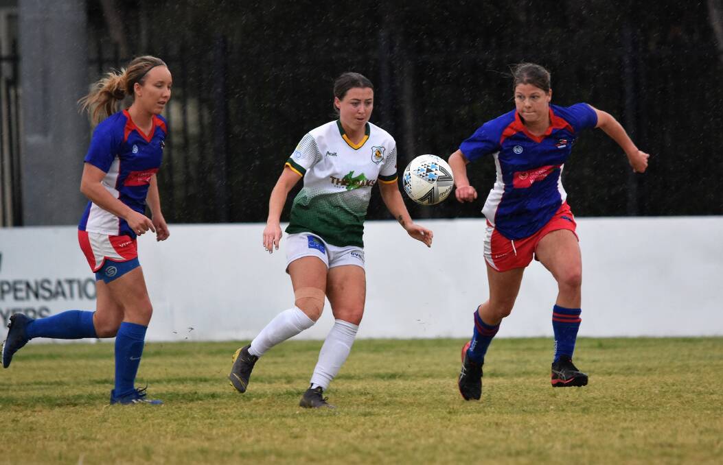 FOCUSED: Albion Park striker Brittany Ring (centre) looks to get past a couple of Woonona opponents on Sunday. Picture: Kiah Hufton
