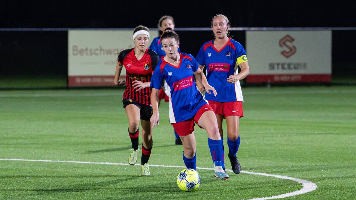 Woonona's Jessica Beale races the ball downfield at Ian McLennan Park on Sunday night. Picture - @gragrapix
