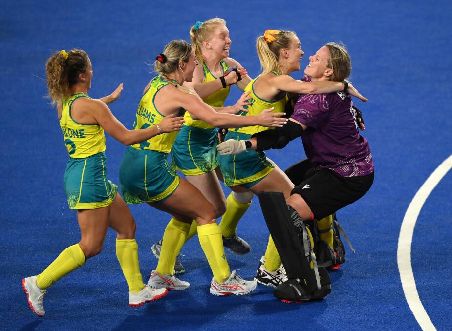 HAPPY DAYS: Hockeyroos players celebrate with goalkeeper Jocelyn Bartram (right) after they beat India in their semi-final on Saturday morning (AEDT). Picture: Alex Davidson/Getty Images