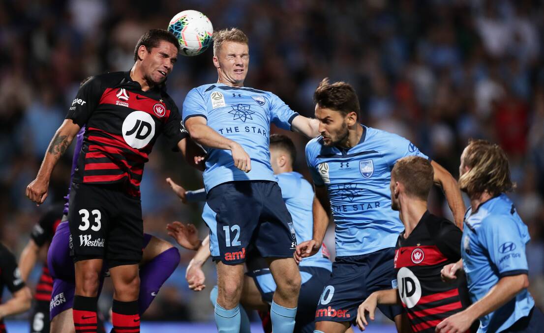 BATTLE: Tate Russell (left) in action during a Sydney derby last season. Picture: Matt King/Getty Images