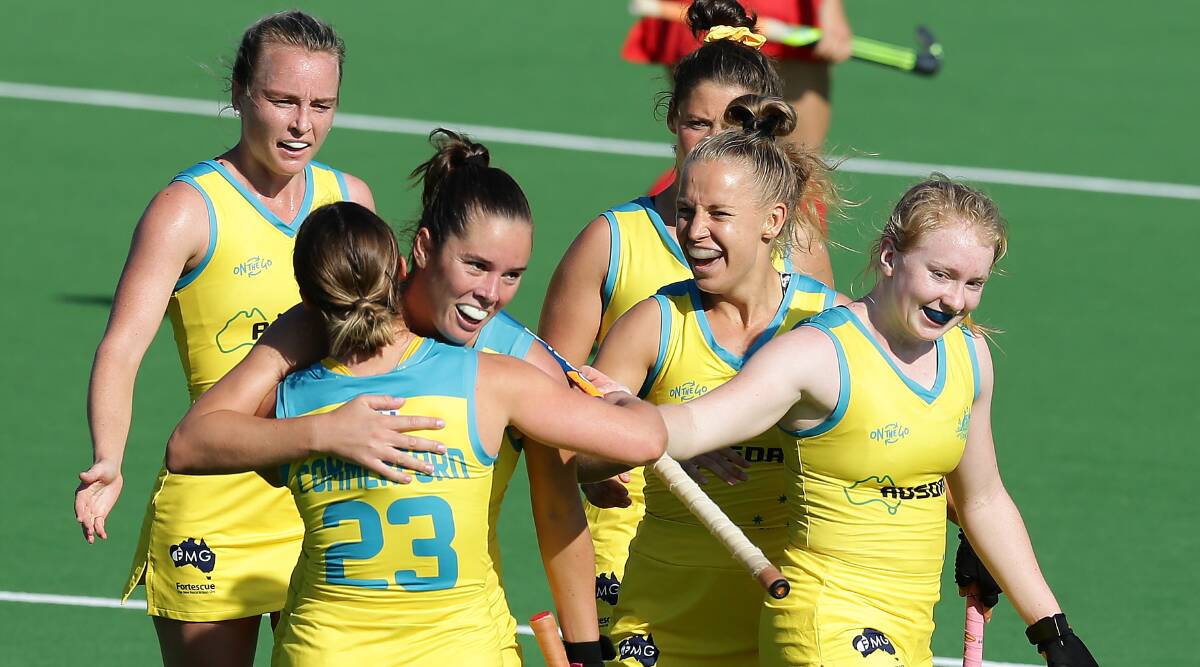 TOGETHER: Grace Stewart (centre) celebrates with her fellow Hockeyroos after scoring a goal last month. Picture: Will Russell/Getty Images