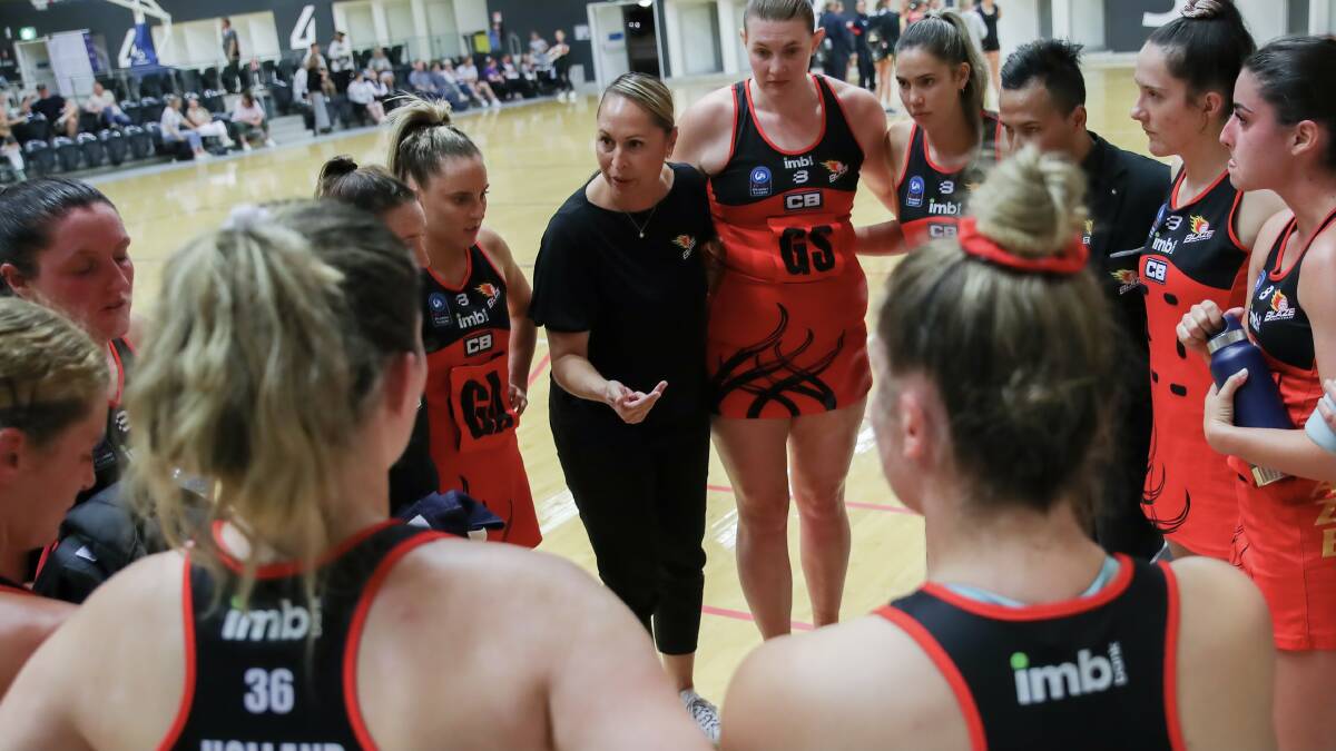 DETERMINED: Blaze coach Marji Parr (centre) gives instructions to her opens players during a game this season. Picture: May Bailey/Clusterpix Photography
