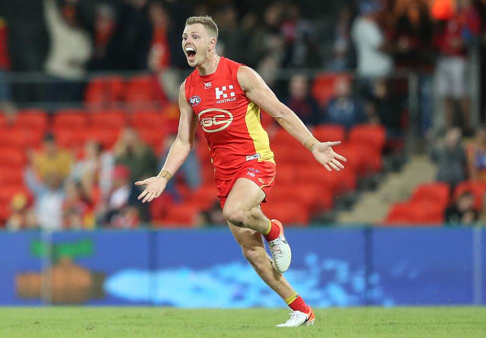 HAPPY: Nick Holman will plays his 50th AFL game on Saturday. Picture: GC Suns