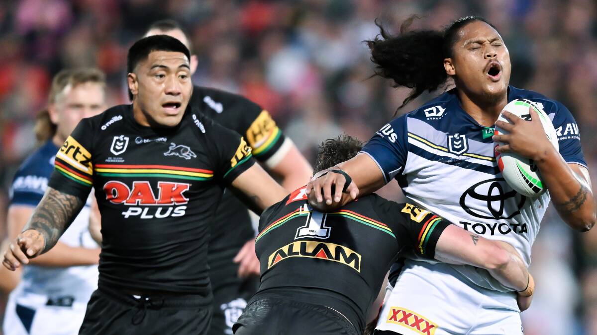 Former Cowboys forward Luciano Leilua is tackled by Penrith's Dylan Edwards during a NRL clash at BlueBet Stadium last September. Picture by Izhar Khan/Getty Images