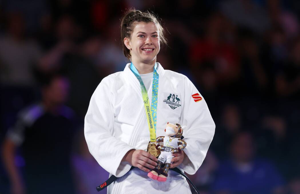 VICTORY: Berry's Tinka Easton celebrates after claiming gold in the women's judo 52kg final on Tuesday morning (AEDT). Picture: Dean Mouhtaropoulos/Getty Images