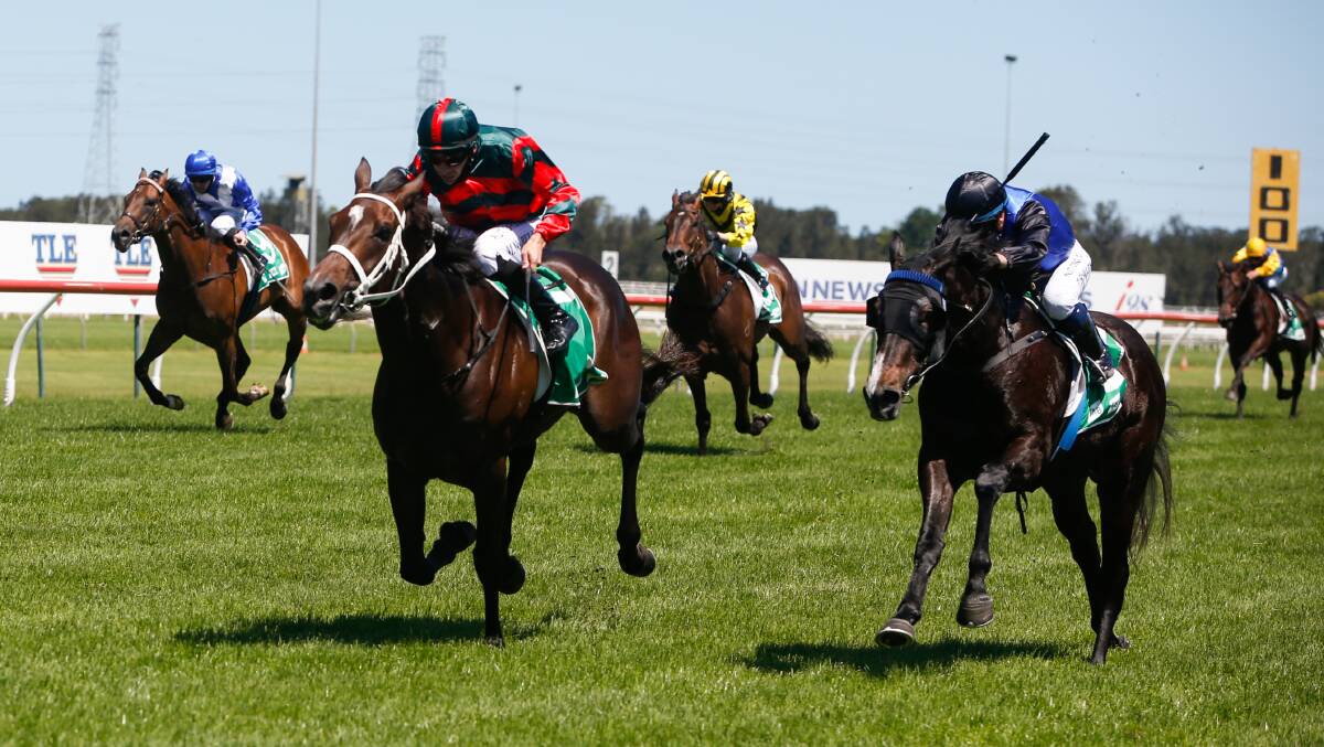 POWERING AHEAD: Yiyi (left), ridden by Mitchell Bell, wins the Maiden Handicap over 1300 metres from Nearly Fine at Kembla Grange on Saturday. Picture: Anna Warr