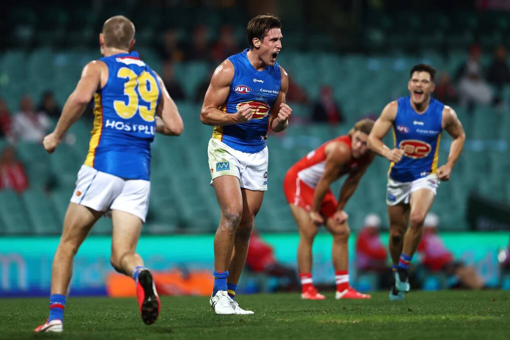 DOMINANT: Gold Coast co-captain David Swallow celebrates after scoring a late goal to cap the Suns' win over the Swans on Saturday afternoon. Picture: Cameron Spencer/AFL Photos via Getty Images