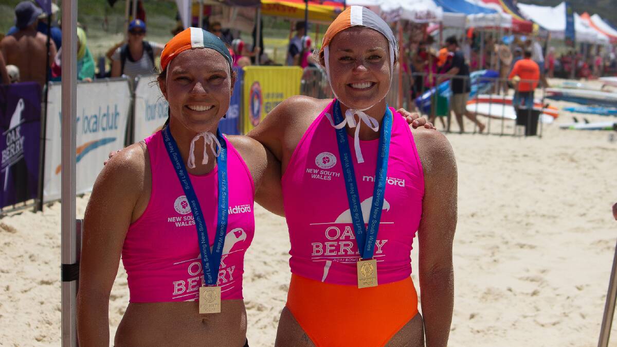 Warilla-Barrack Point SLSC's Jade Bagnell (left) and Jordan White proudly show off their medals after winning the 2023 NSW Country Surf Life Saving Club Championships. Picture - Warilla-Barrack Point SLSC