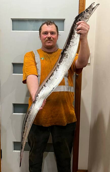 Tall tale: Tim Morgan with his first hairtail from Georges River.