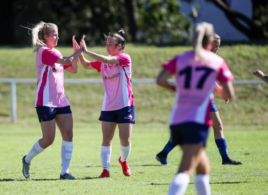 BACK IN BUSINESS: Two Stingrays players high five after scoring a goal against the Emerging Jets at JJ Kelly Park last year. Picture: Adam McLean