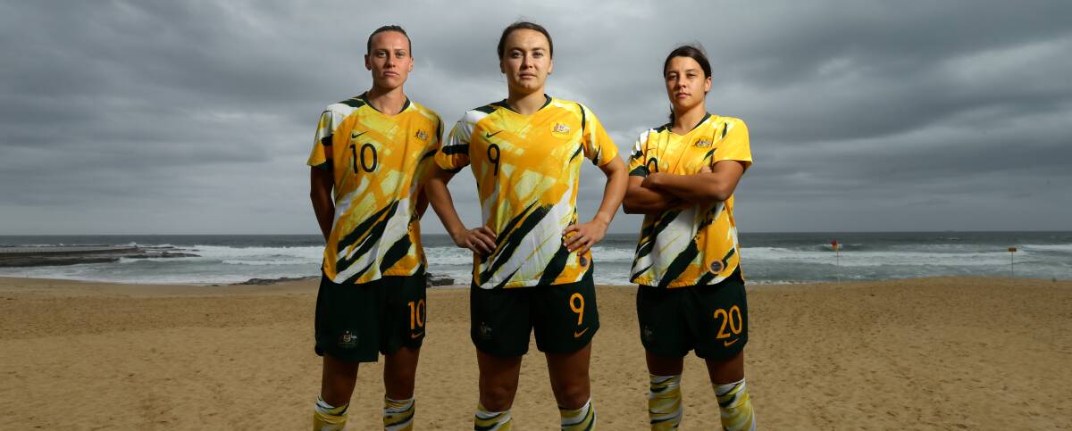 PROUD MATILDAS: Emily Van Egmond, Caitlin Foord and Sam Kerr pose for a photo at Newcastle Beach earlier this year. Picture: Jonathan Carroll