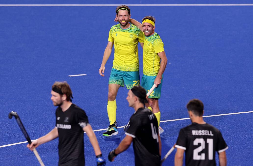 HAPPY DAYS: Wollongong's Flynn Ogilvie celebrates with his teammate after the Kookaburras scored against New Zealand on Tuesday (AEDT). Picture: Mark Kolbe/Getty Images
