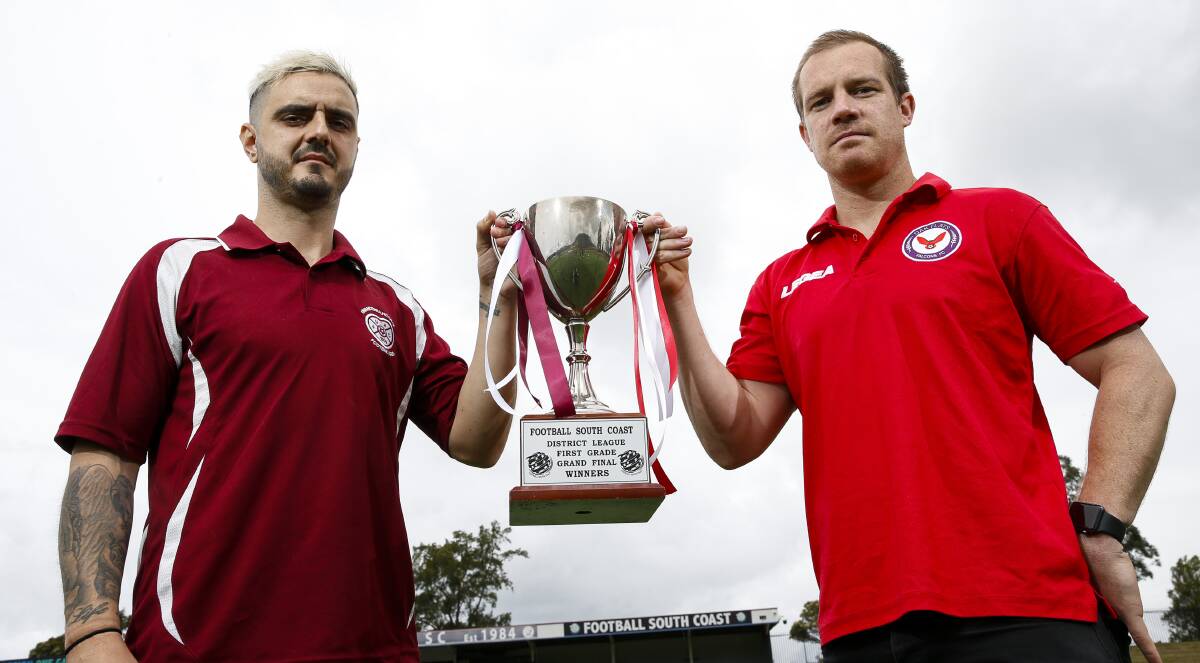 ON THE LINE: Unanderra's Luke Picciolini (left) and Brenton Lloyd of Oak Flats hold up the District League trophy. Picture: Anna Warr