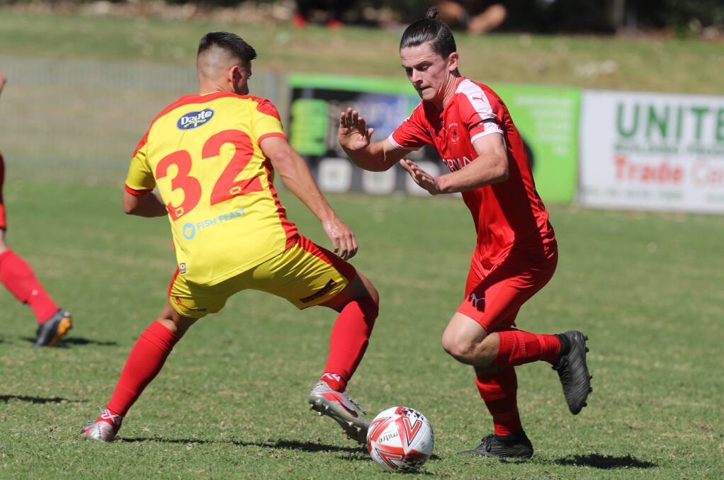 FOCUSED: Corrimal's Toby Norval (right) looks to get past United player James Stojanovski. Picture: Robert Peet