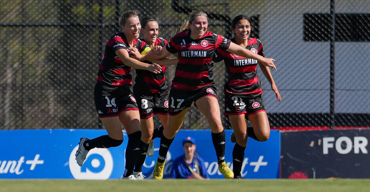 Sheridan Gallagher celebrates with her Wanderers teammates after scoring a goal in the A-League Women's competition. Picture - @gragrapix / Zenith SEM