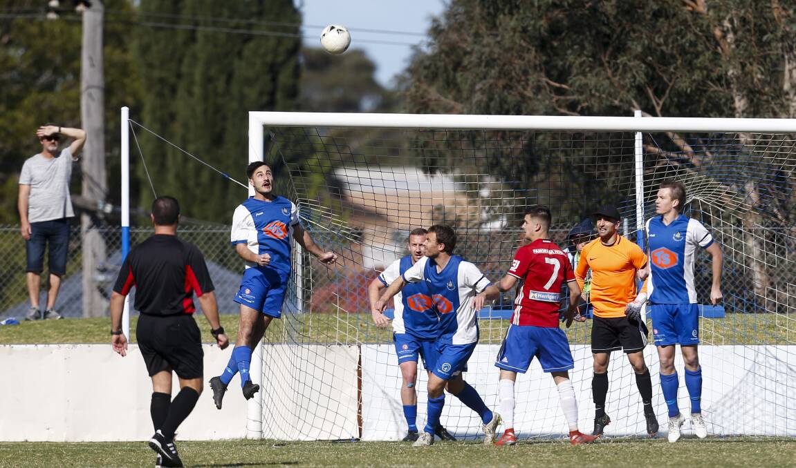 Tarrawanna's Jake Morlando flies high for a header during last year's Illawarra Premier League minor semi-final against Albion Park White Eagles. Both teams are competing in the 2020 FFA Cup. Picture: Anna Warr