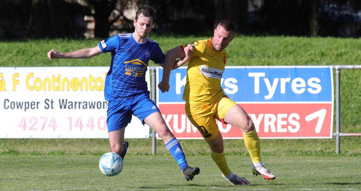 Bulli's Kyle Jackson (left) looks to maintain possession ahead of United opponent Dinko Terzic during an IPL game earlier this season. Picture by Sylvia Liber