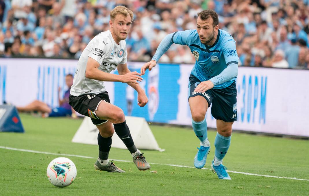 ON THE MOVE: Sydney FC forward Adam Le Fondre (right) looks to beat his Melbourne City opponent to the ball. Picture: Jaime Castaneda