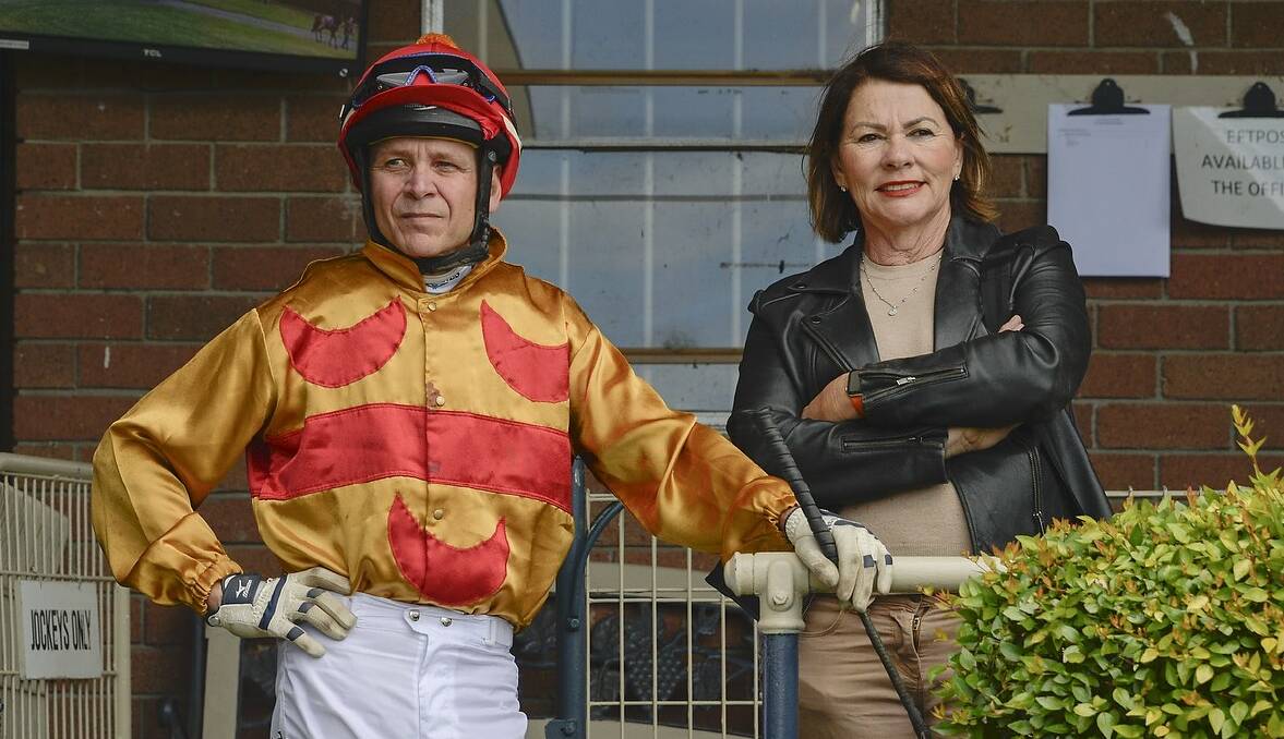 PREPARED: Berry trainer Cheryl Roberts chats with jockey Troy Phillips at Nowra last week. Picture: Bradley Photographers