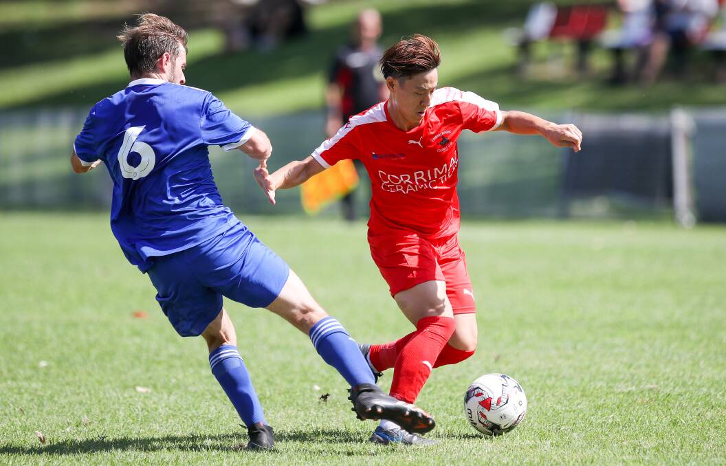 CONCERNED: Japanese import Taira Yoshimura (right) in action for Corrimal Rangers during a pre-season contest. Picture: Adam McLean