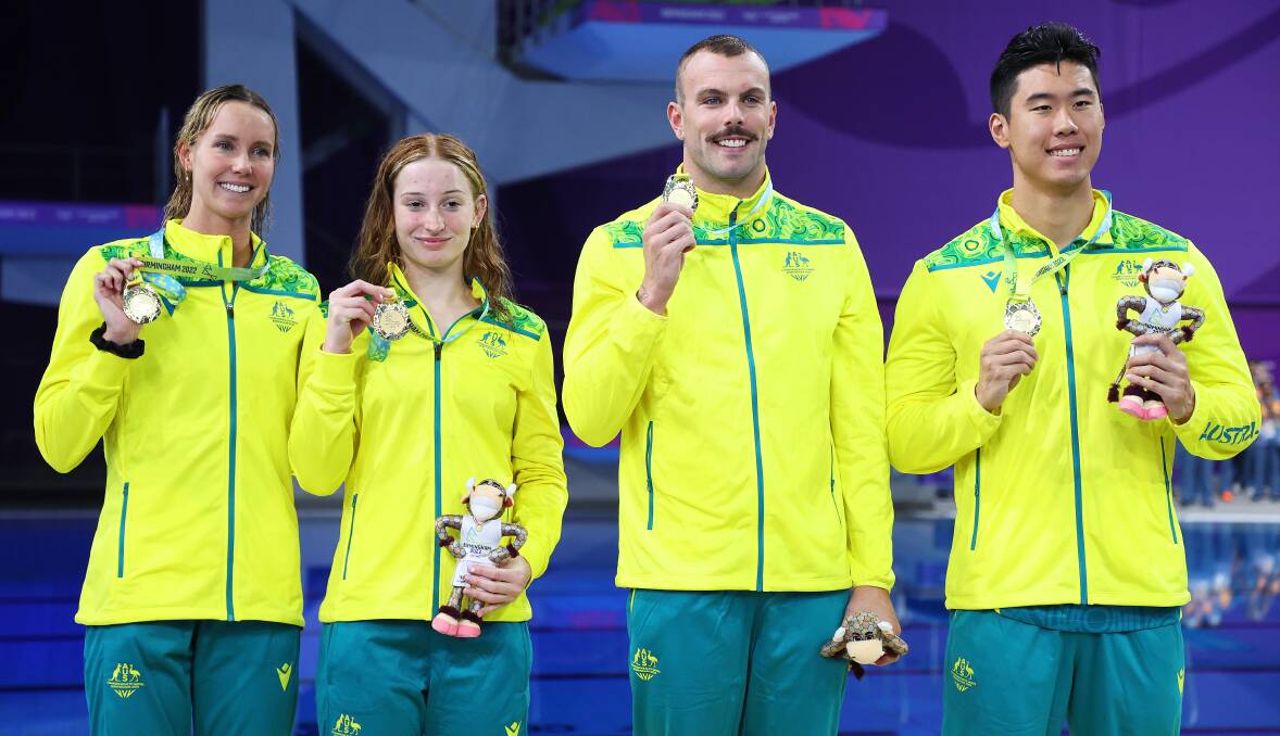DELIGHT: Emma McKeon (left) celebrates with her fellow Aussies Mollie O'Callaghan, Kyle Chalmers and William Zu Yang after claiming gold in the mixed 4x100m freestyle relay. Picture: Al Bello/Getty Images