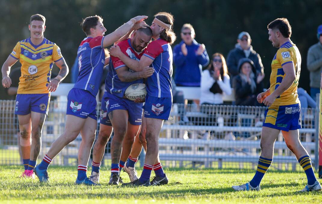 DOMINANT: Dylan Farrell celebrates with his Lions teammates after scoring a try. Picture: Adam McLean