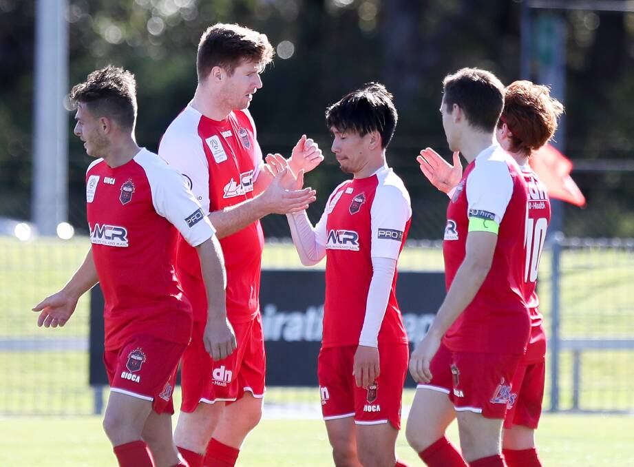 HAPPY DAYS: Takeru Okada celebrates with his Wollongong Wolves teammates after scoring a goal against North Shore Mariners on Sunday afternoon. Picture: Adam McLean