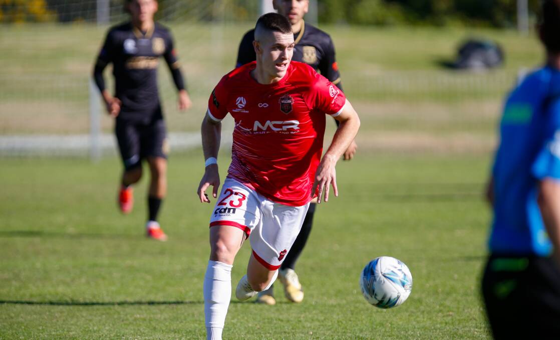 Wollongong Wolves defender Walter Scott is focused on getting the job done against Bulls Academy on Friday night. Picture by Anna Warr