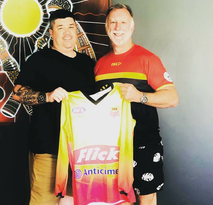 EXCITED: New coach Russell Stewart (left) receives a Suns jersey from Shellharbour club president Stephen Ashworth. Picture: Shellharbour Suns