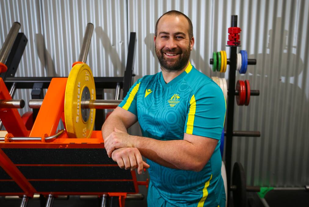 OVER THE MOON: Simon Bergner, pictured at the National Strength Performance Centre in Bulli, was head coach for the Australian Para-powerlifting team at the Commonwealth Games. Picture: Wesley Lonergan