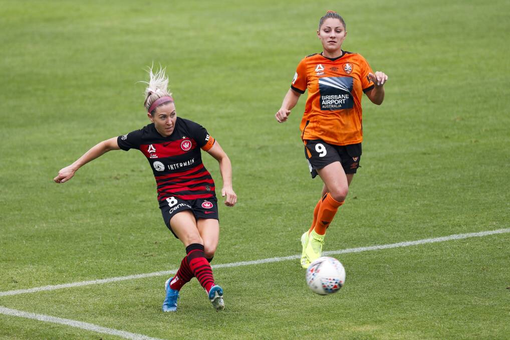 ON TARGET: Western Sydney Wanderers captain Erica Halloway passes the ball against the Roar this season. Picture: David Neilson/Getty Images
