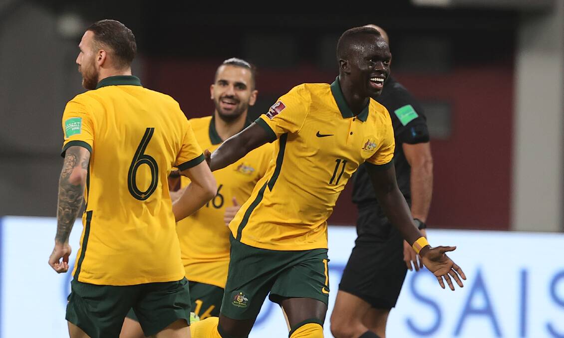 PARTY TIME: Australia's Awer Mabil celebrates after scoring against Oman at Khalifa International Stadium, Doha. Picture: Stringer/Anadolu Agency via Getty Images