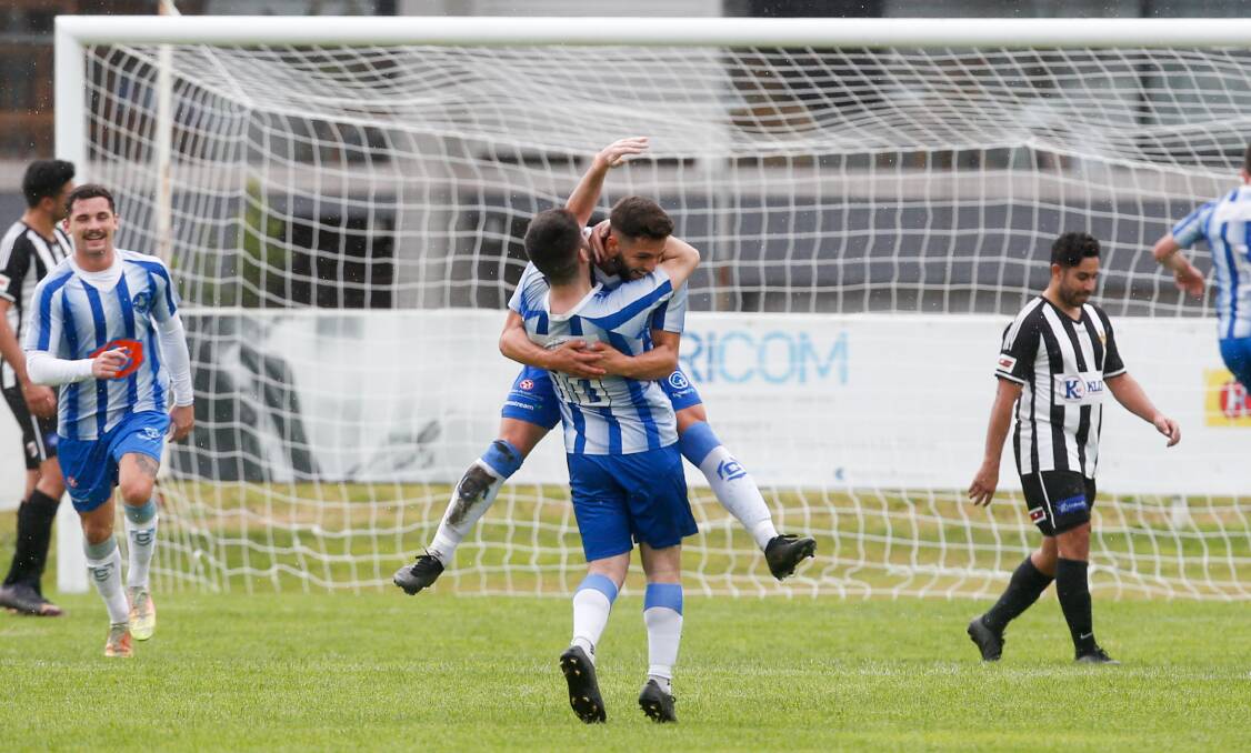 HAPPY DAYS: Jordan Gjorsevski (10) celebrates with a teammate after Tarrawanna scored their second goal against Port Kembla on Sunday. Picture: Anna Warr