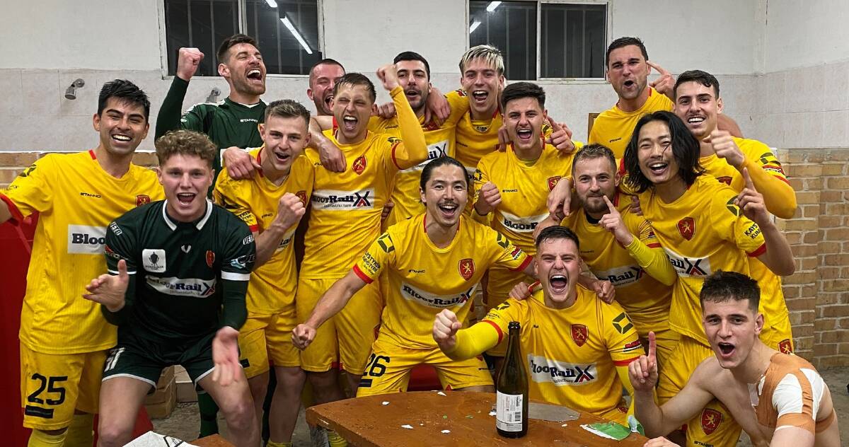 Wollongong United players celebrate after winning the 2022 Illawarra Premier League title on Friday night. Picture by Richie Wagner/Wollongong United FC
