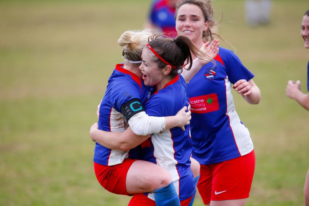 DELIGHT: Ainsley Hawes celebrates with teammates after scoring a goal for Woonona at Ocean Park on Sunday. Picture: Anna Warr