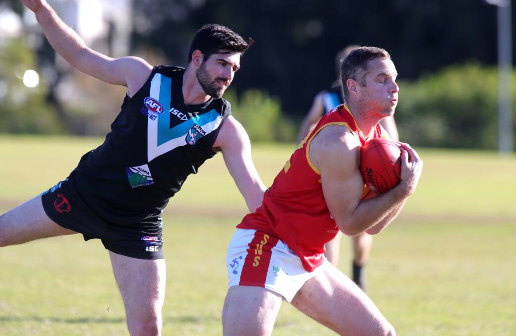 Shellharbour playing-coach Dan Posch takes a strong mark during an AFL South Coast game last year. Picture by Sylvia Liber