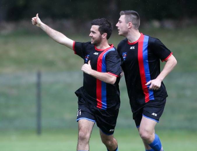 Cameron Besgrove celebrates with a Woonona teammate after scoring a goal during a recent Premier League game. Picture: Adam McLean