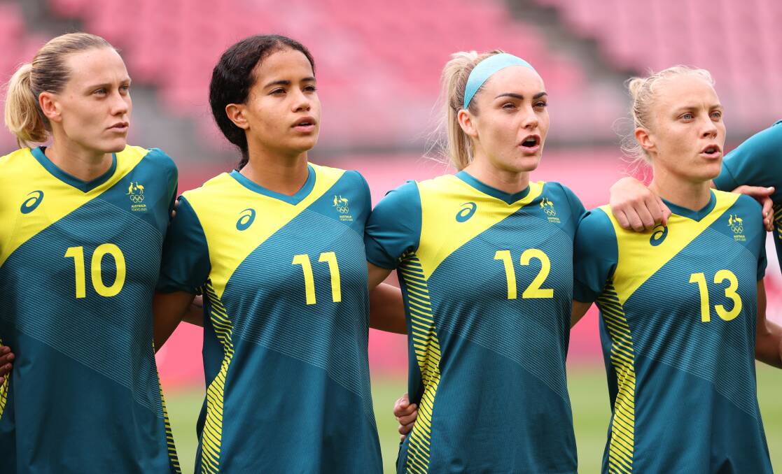 PROUD: Matildas players Emily Van Egmond, Mary Fowler, Ellie Carpenter and Tameka Yallop line up for the national anthem. Picture: Atsushi Tomura/Getty Images