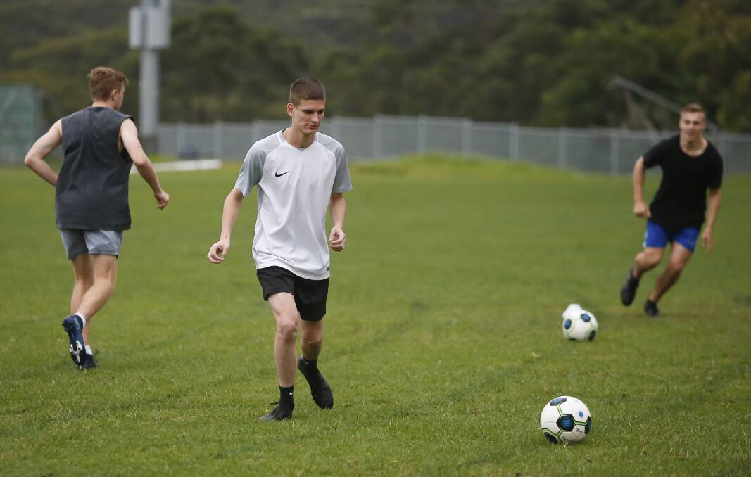 HARD AT WORK: Helensburgh Thistles' Ben Watts runs through a training drill earlier this year. Picture: Anna Warr