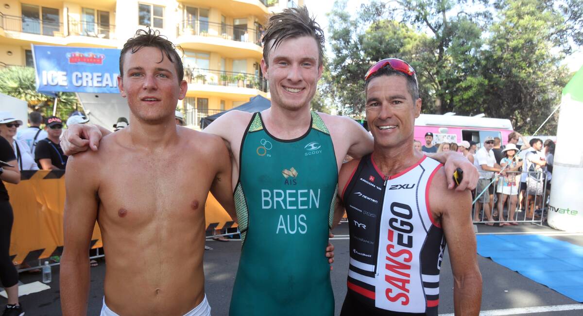 DELIGHTED: Nathan Breen celebrates winning last year's Aquathon with Troy Whittington (third) and Craig Alexander (second). Picture: Robert Peet 