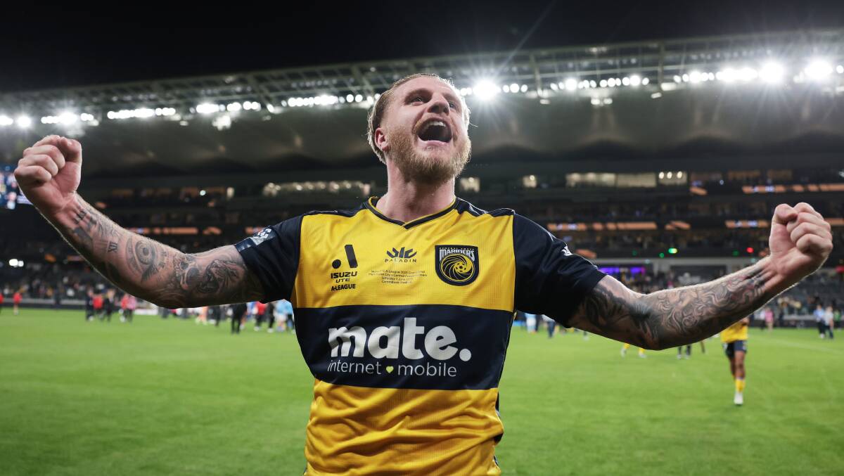 Mariners forward Jason Cummings reacts with fans after winning Saturday night's grand final against Melbourne City. Picture by Mark Metcalfe/Getty Images