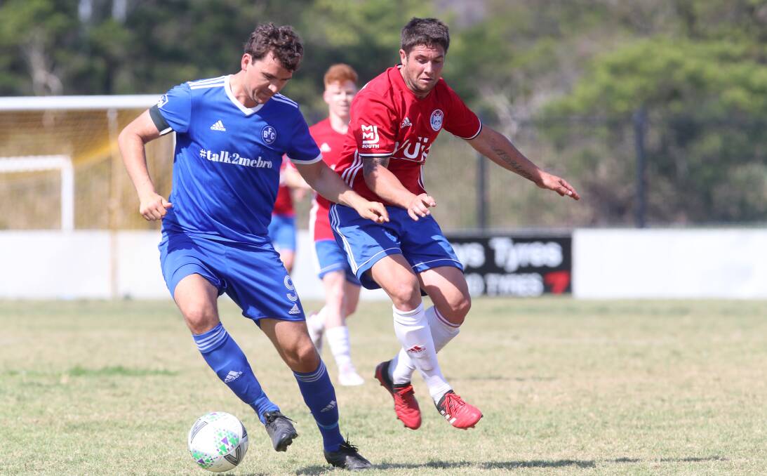 EYES ON THE BALL: Albion Park's Brendan Fordham (right) chases after Bulli opponent Ben McDonald during a recent game. Picture: Sylvia Liber