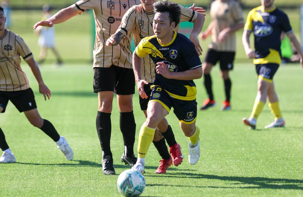 Genki Iwata runs the ball forward during a recent match for South Coast Flame. Picture by Adam McLean