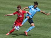 FOCUSED: Marcus Beattie (left) competes with Milos Ninkovic for the ball last year. Picture: Robert Peet
