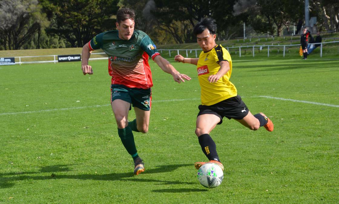 Coniston's Tommy Fujieda (right) scored the match-winning goal on Saturday. Picture: Noel Wynn