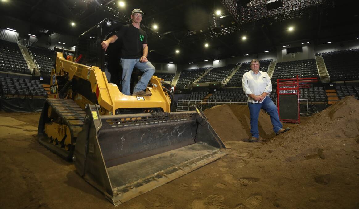 SNEAK PEEK: Paul Duran and Doug Vickers have been hard at work preparing the bull riding arena for Rodeo 4 Life at the WIN Entertainment Centre. Picture: Robert Peet