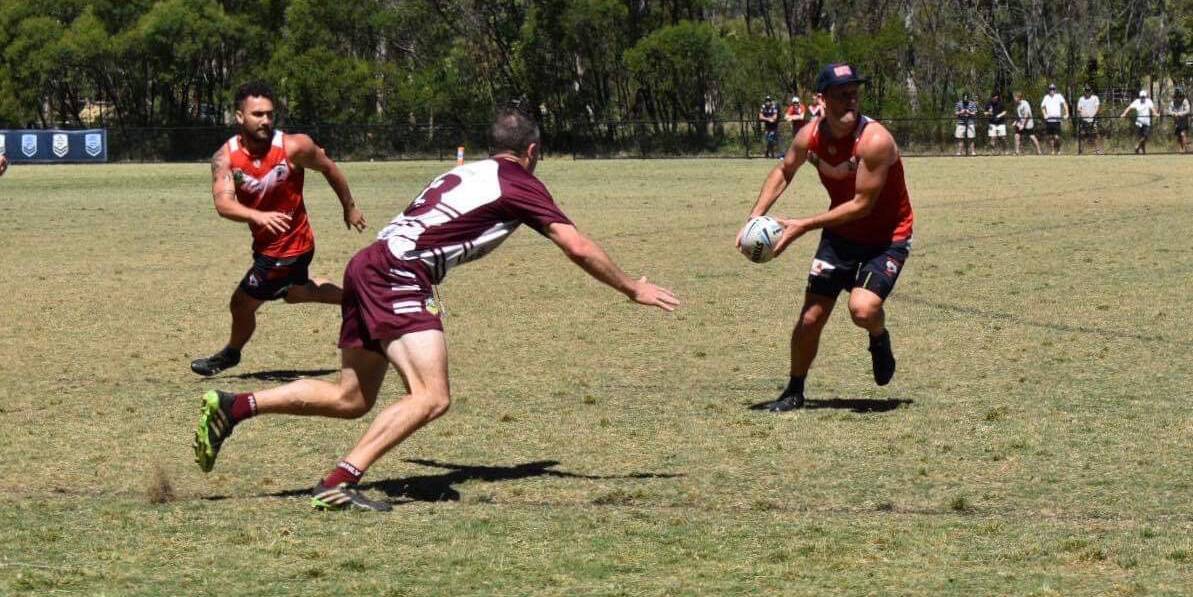 OPPORTUNITY: Wollongong's Tim Robinson prepares to pass the ball to a team mate during the recent Vawdon Cup. 